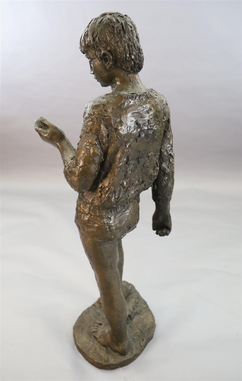 § Karin Jonzen (1914-1998). A bronze figure of a standing boy holding an ammonite shell, height 44in.